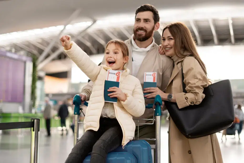 Happy family at airport assisted by immigration consultant in Sydney