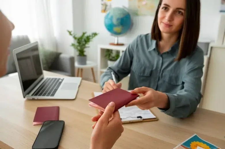 A PACE Migration consultant reviewing documents and holding a passport for a Labour Agreement Visa service